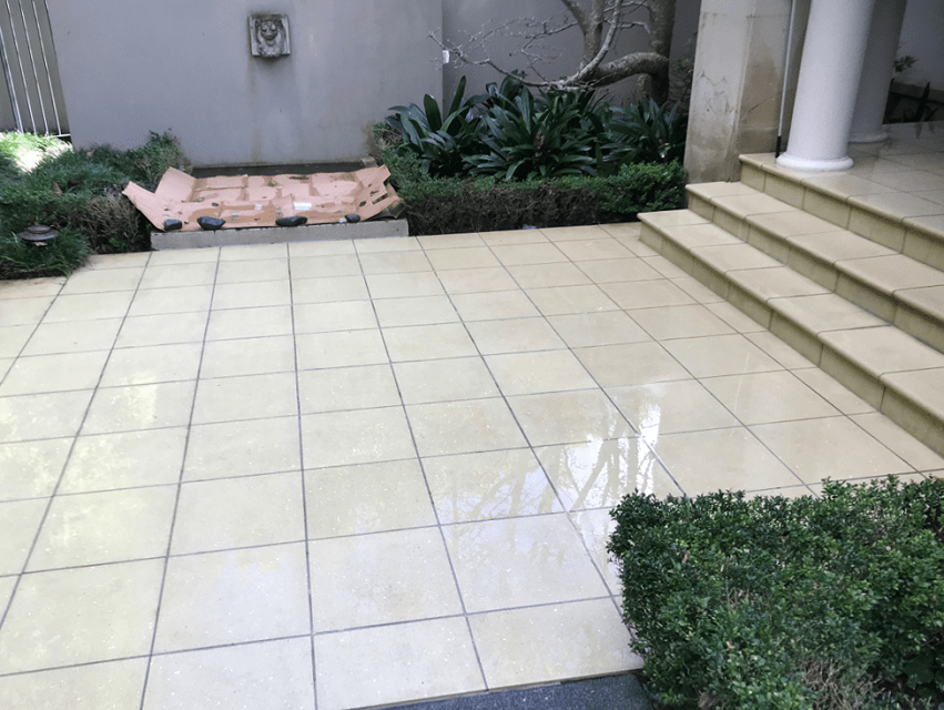 Waterblasting after 2-min White-colored tiles floor is shining after Waterblasting to remove the dirt.